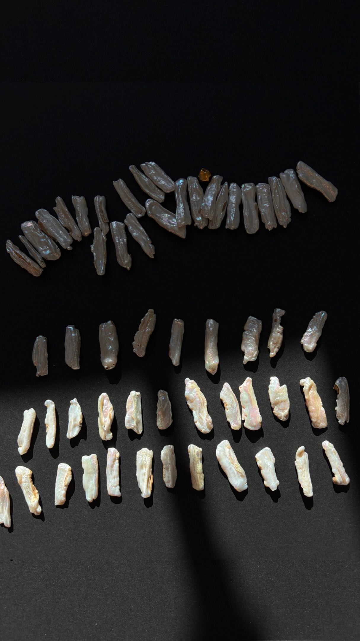 Raw biwa pearls sorted by shade