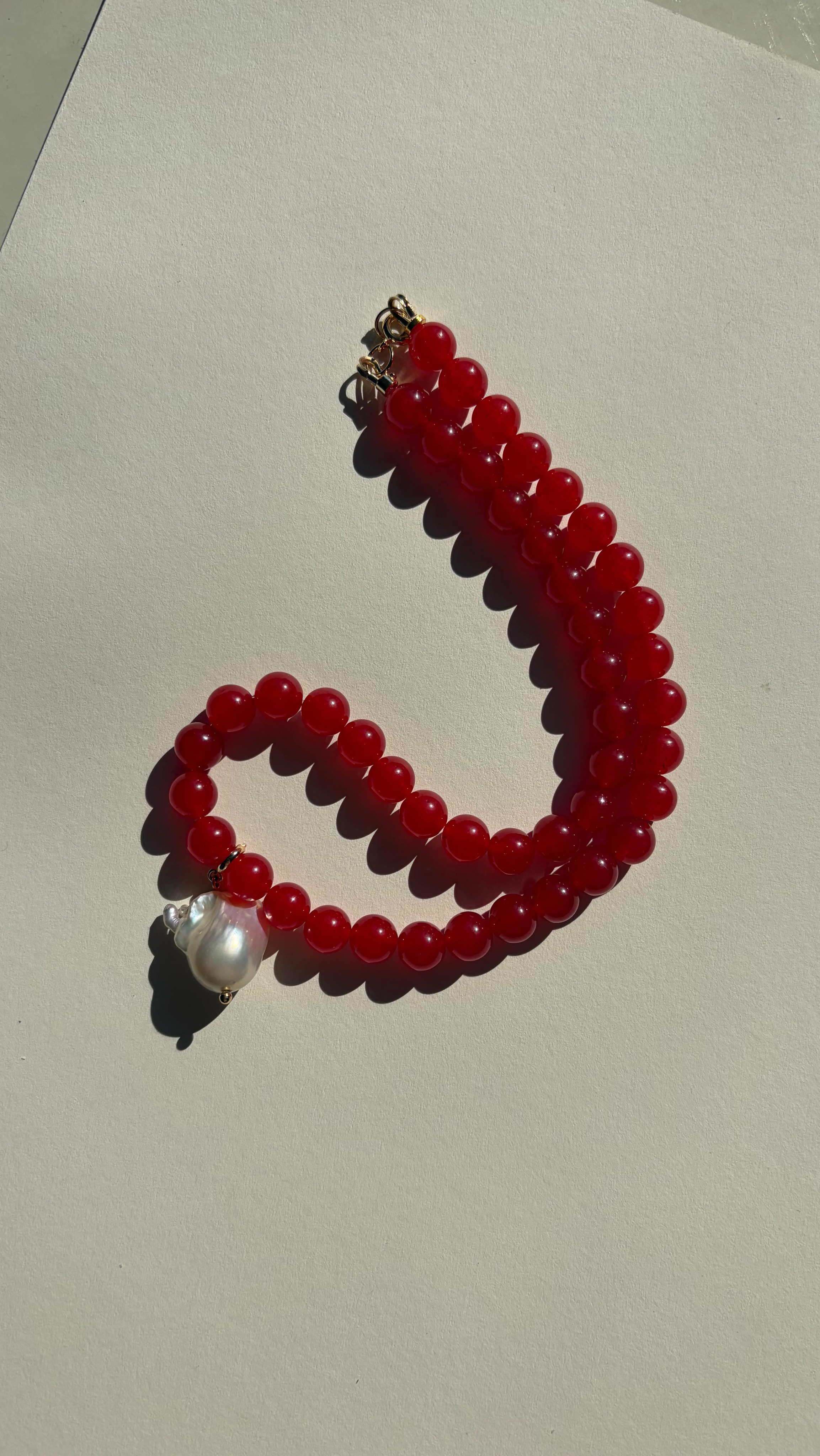 Red jade necklace with baroque pearl pendant